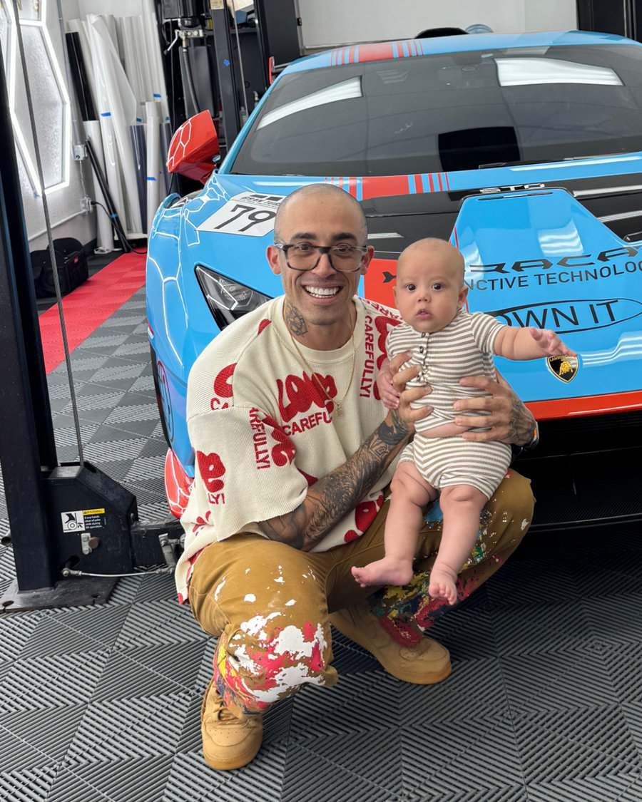 Xavi Santos with his son in front of his race car