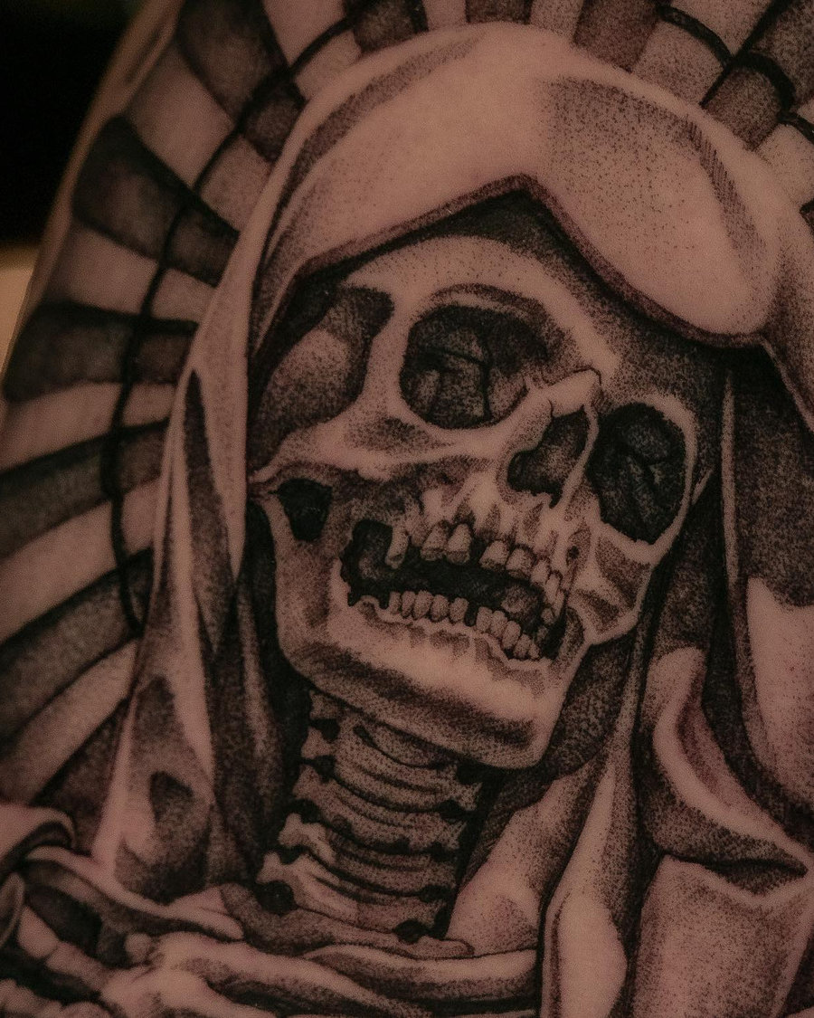 Santa Muerte skull tattoo in black and grey